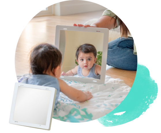 Baby looking at the Framed Mirror from The Charmer Play Kit
