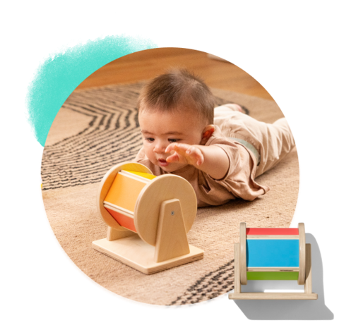 Baby spinning the Spinning Rainbow from The Senser Play Kit
