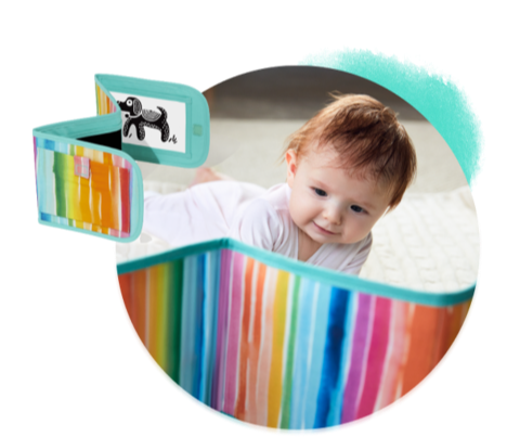 Baby looking at the Standing Card Holder from The Looker Play Kit