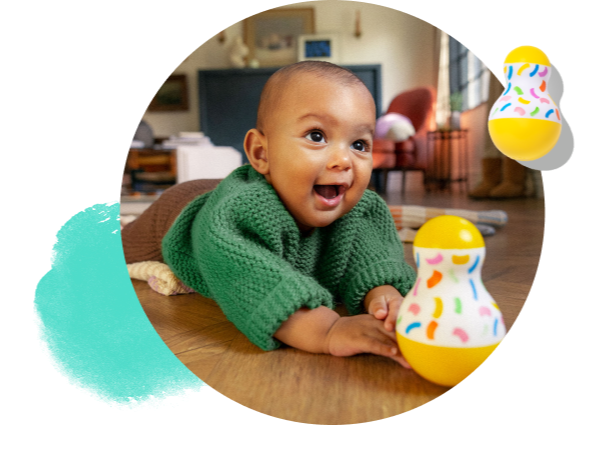 Happy baby with the Tummy Time Wobbler from The Senser Play Kit